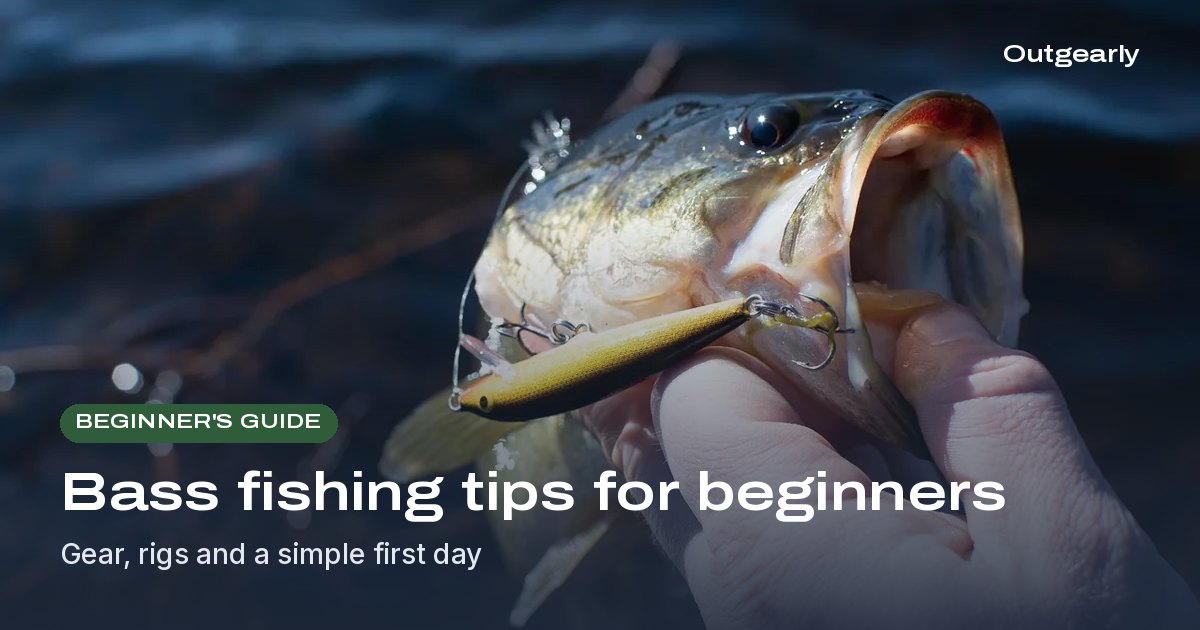 Beginner's guide: Hand holding a largemouth bass with a gold minnow-style lure hooked in its mouth beside dark water
